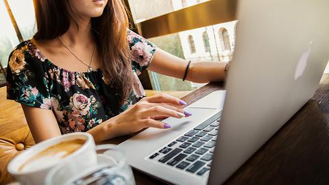 Girl with a laptop studying.