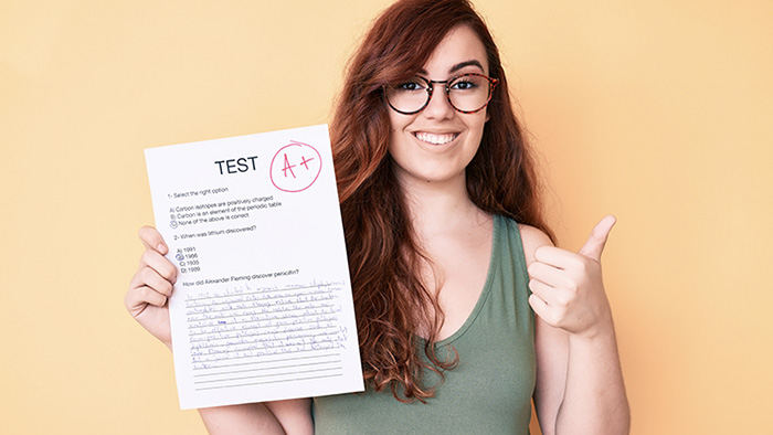 Online Florida real estate course and girl holding an A+ result.