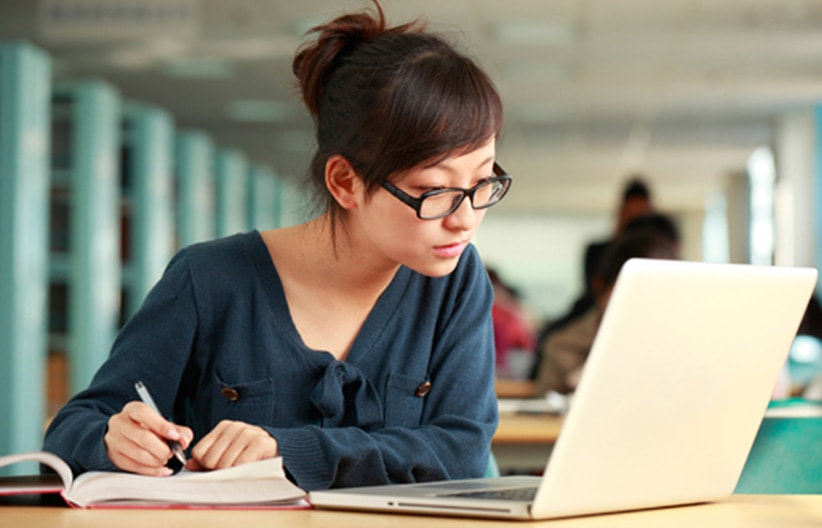 Girl using laptop.