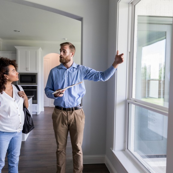 real estate agent showing a home